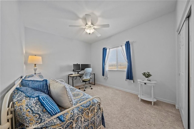 bedroom with a closet, ceiling fan, and carpet