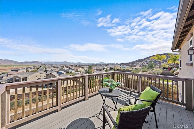 wooden terrace featuring a mountain view