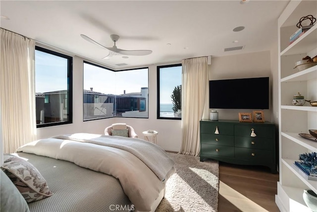 bedroom featuring ceiling fan and wood-type flooring