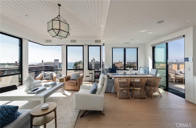 living room featuring wood ceiling and light hardwood / wood-style flooring