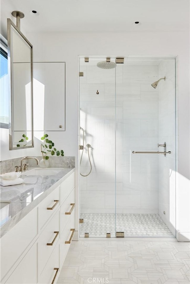 bathroom with vanity and an enclosed shower