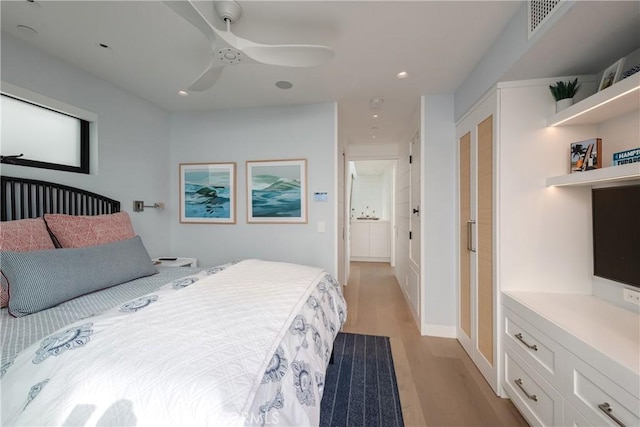 bedroom with light hardwood / wood-style flooring and ceiling fan