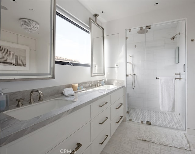 bathroom with walk in shower and vanity