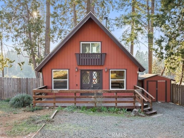 rear view of house with a shed