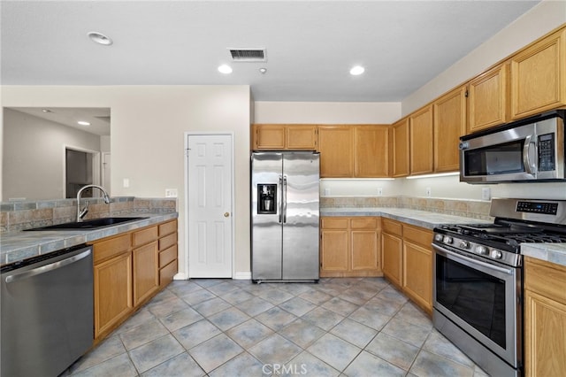 8015 Ralston Pl, Riverside, CA 92508 - kitchen featuring stainless steel appliances, a sink, recessed lighting, and light tile patterned floors