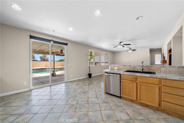 8015 Ralston Pl, Riverside, CA 92508 - kitchen with a sink, dishwasher, a ceiling fan, baseboards, and recessed lighting