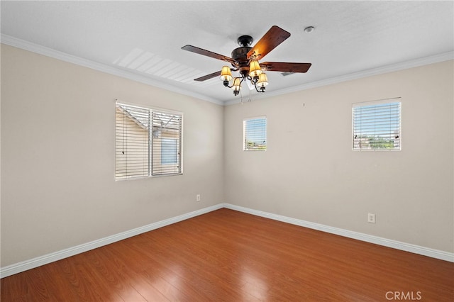 8015 Ralston Pl, Riverside, CA 92508 - spare room featuring wood finished floors, baseboards, plenty of natural light, and ornamental molding