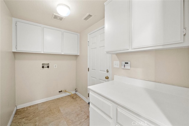 8015 Ralston Pl, Riverside, CA 92508 - laundry room with baseboards, hookup for a washing machine, hookup for a gas dryer, and cabinet space