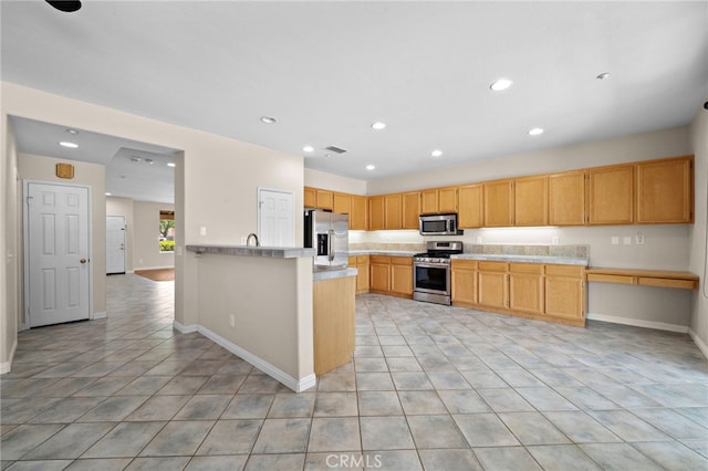 8015 Ralston Pl, Riverside, CA 92508 - kitchen featuring appliances with stainless steel finishes, light countertops, recessed lighting, baseboards, and light tile patterned flooring
