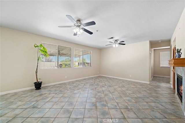 8015 Ralston Pl, Riverside, CA 92508 - unfurnished room featuring a glass covered fireplace, a ceiling fan, and baseboards