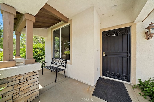 8015 Ralston Pl, Riverside, CA 92508 - view of exterior entry featuring stucco siding and covered porch