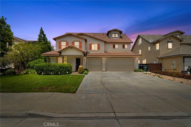 8015 Ralston Pl, Riverside, CA 92508 - view of front of house featuring a garage, concrete driveway, stucco siding, and a tiled roof