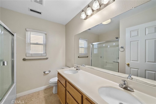 8015 Ralston Pl, Riverside, CA 92508 - bathroom featuring healthy amount of natural light, baseboards, double vanity, and toilet