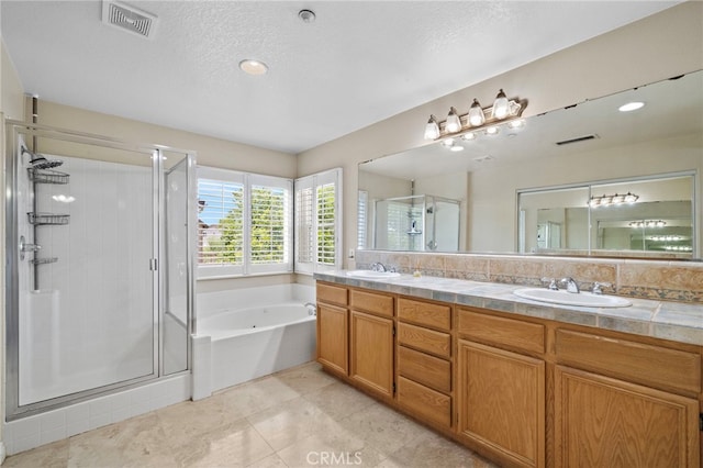 8015 Ralston Pl, Riverside, CA 92508 - bathroom with a shower stall, a bath, double vanity, tile patterned floors, and a textured ceiling