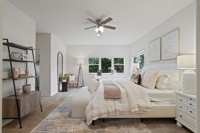 bedroom with ceiling fan and carpet