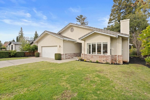 view of front of home featuring a garage and a front lawn