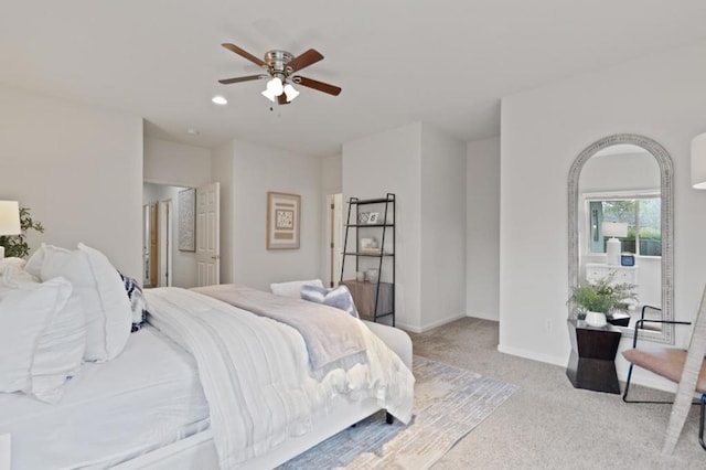 bedroom with light carpet and ceiling fan