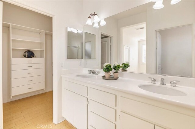 bathroom featuring vanity and wood-type flooring