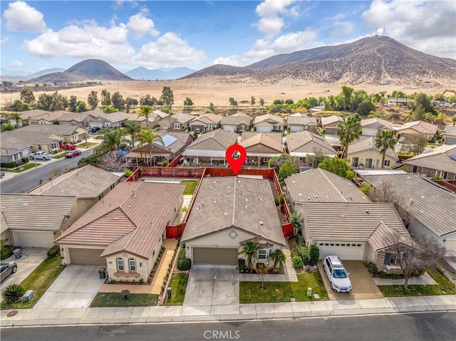 birds eye view of property featuring a mountain view