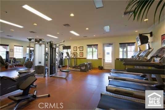 gym featuring a wealth of natural light