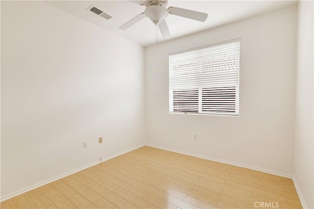 unfurnished room with ceiling fan and light wood-type flooring