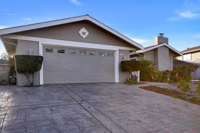 ranch-style house featuring a garage