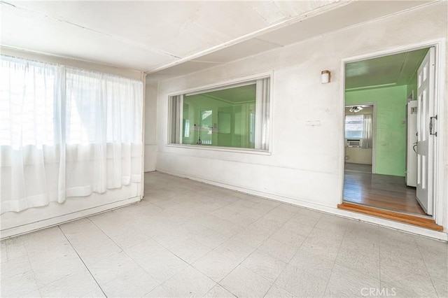 spare room featuring a wealth of natural light