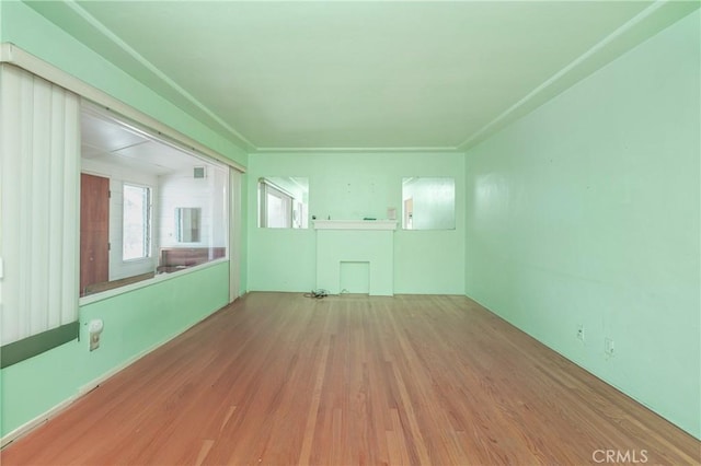 unfurnished room featuring hardwood / wood-style flooring