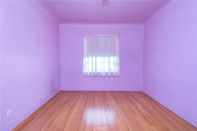 spare room featuring light hardwood / wood-style flooring