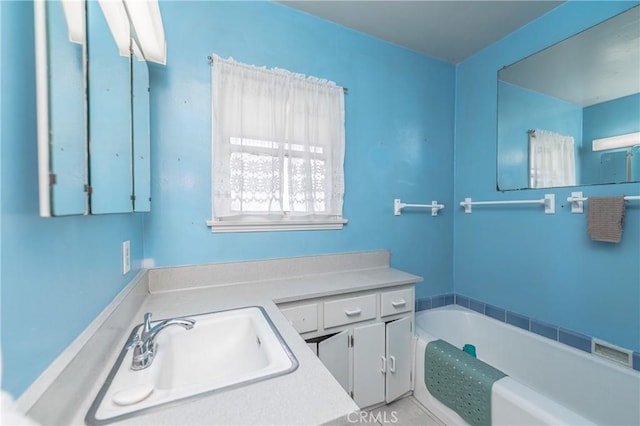 bathroom featuring vanity and a bathtub