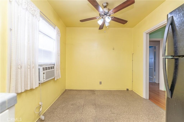 empty room with cooling unit and ceiling fan