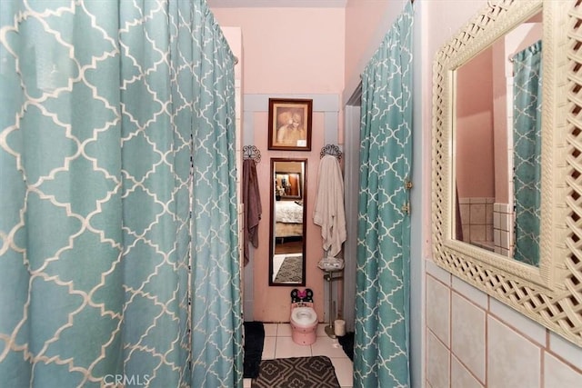 bathroom with tile patterned floors