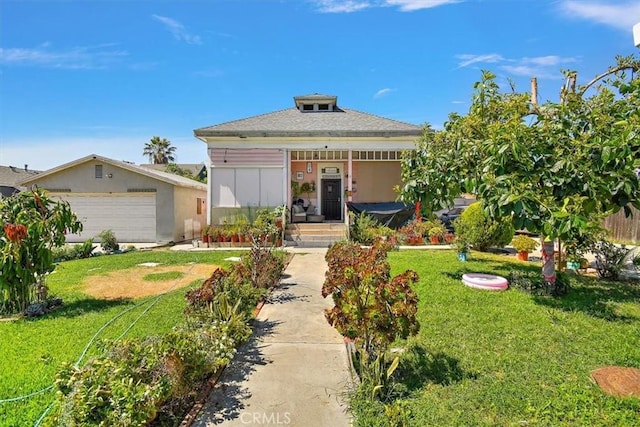 view of front of property with a garage and a front yard