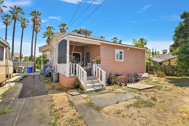 bungalow-style home with a patio