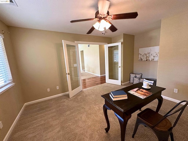 carpeted office featuring ceiling fan and french doors