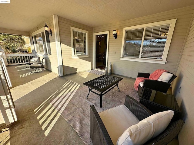 view of patio featuring an outdoor living space and covered porch