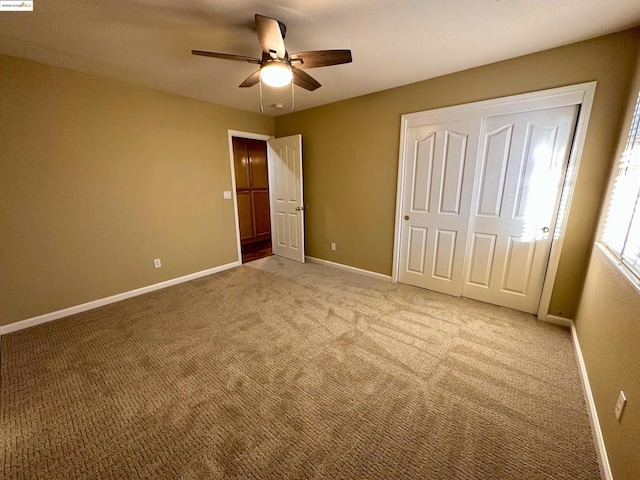 unfurnished bedroom featuring ceiling fan and light carpet