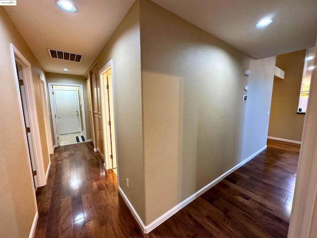 hall featuring dark wood-type flooring