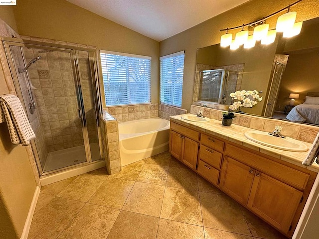 bathroom with tile patterned flooring, plus walk in shower, lofted ceiling, and vanity