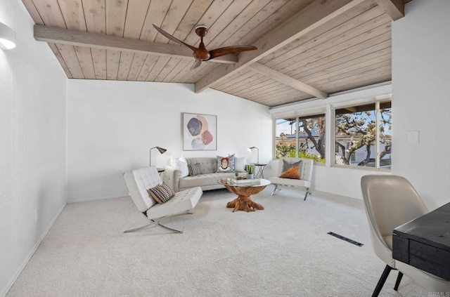 carpeted living room with vaulted ceiling with beams, wooden ceiling, and ceiling fan