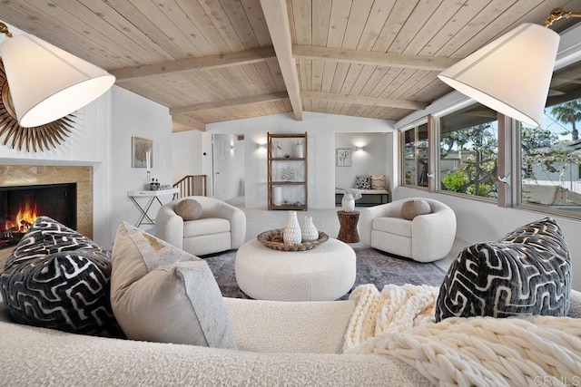 living room featuring lofted ceiling with beams and wooden ceiling