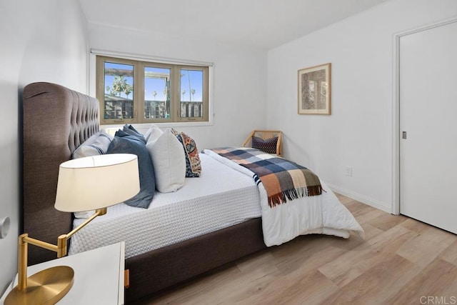 8348 Paseo Del Ocaso Ln, Jolla, CA 92037 - bedroom with baseboards and wood finished floors
