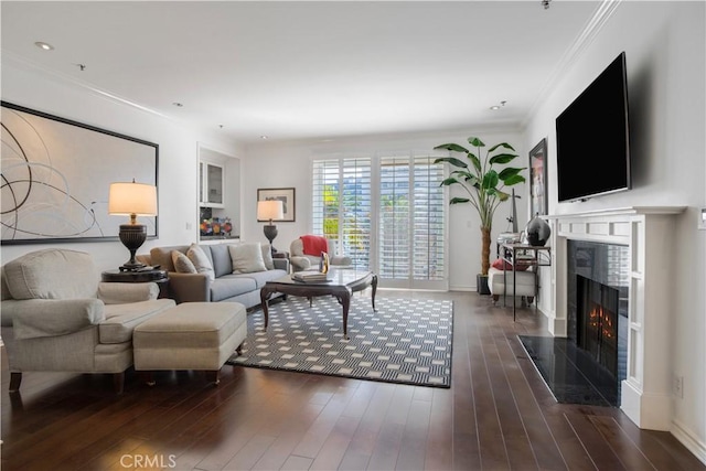 living room with crown molding and dark hardwood / wood-style floors