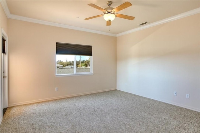 spare room with ornamental molding, ceiling fan, and carpet flooring