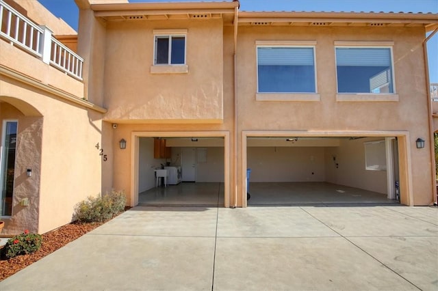 back of house with a garage