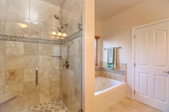 bathroom with tile patterned floors and plus walk in shower