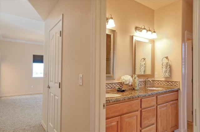 bathroom with vanity and crown molding