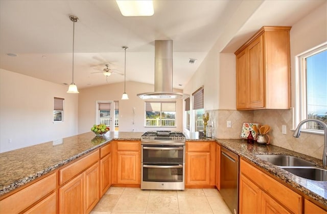 kitchen with island range hood, sink, hanging light fixtures, stainless steel appliances, and a healthy amount of sunlight