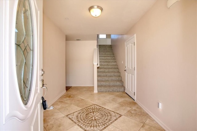 view of tiled foyer entrance