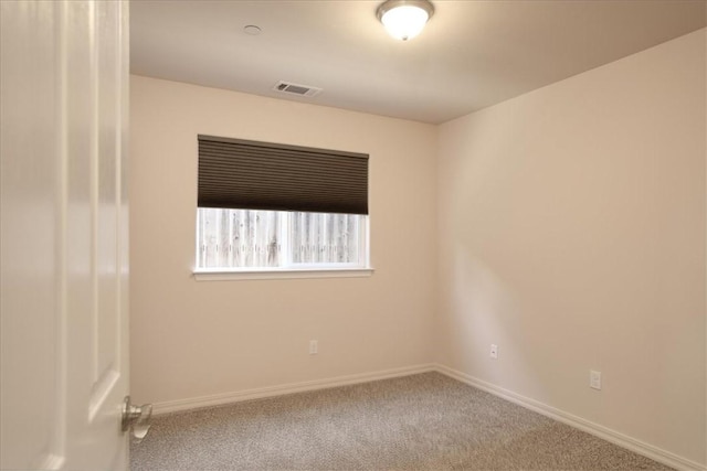 spare room featuring carpet floors